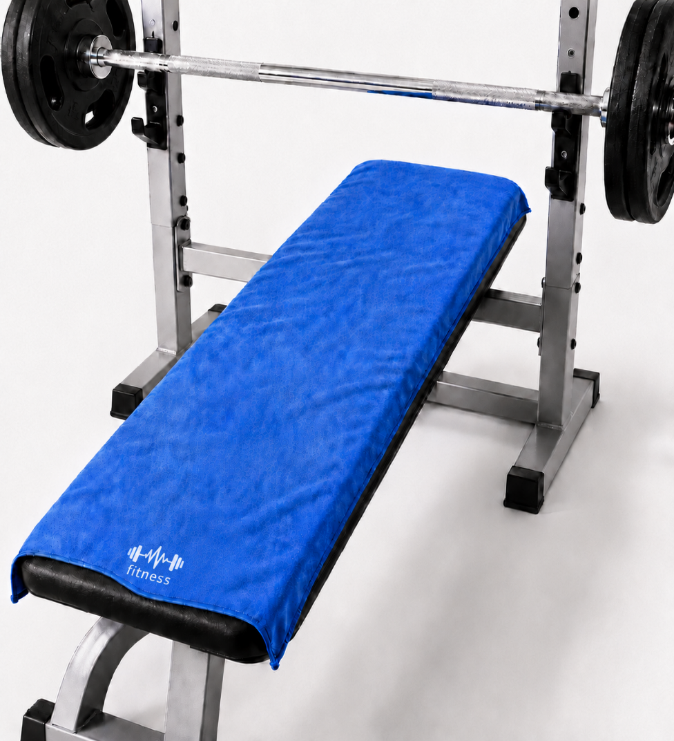 Blue STRIVEX gym towel placed over a workout bench